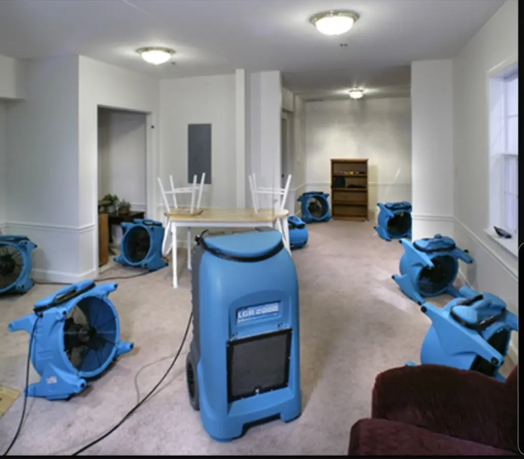 Air movers and dehumidifier setup for Water Damage Restoration in Becker